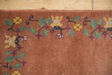 Chinese Art Deco rug, mint green scrolling vines, gold blossoms on a dusty copper field.