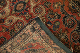 The hand-knotted back and dark machine-bound fabric edge of a vintage Dargezine rug.