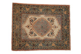 Vintage Tabriz square rug with a central medallion, ivory field, and detailed arabesque border.