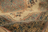 Angled view showing the even, hand-knotted pile and elaborate arabesque border of the vintage Tabriz rug.