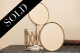 Antique shaving mirror set: round standing, oval expandable mirrors with patina, marked SOLD.