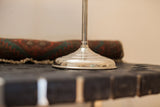 Reflective silver-toned base of the antique shaving mirror, showing attractive patina.