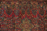 Vintage Sarouk runner's cherry red field with delicate blue, green tendrils and blossoms.
