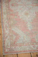 Distressed vintage Oushak runner corner showing mostly even wear, muted blush, and silver tones.
