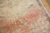 Heavily abrashed dye lot change showing worn texture on a vintage Turkish Oushak rug.