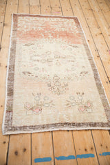 Distressed Turkish Oushak runner showing a dramatic, abrashed color shift from copper to sand.