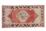Vintage Distressed Oushak runner, brick red abrashed field, hexagonal medallion, charcoal borders.