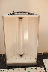 Vintage Graham Field eye exam light box base, fluorescent tube, and eye chart.