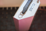 Top corner of vintage Graham Field light box with black handle, label, and red switch.