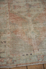 Detailed texture of a distressed Turkish Oushak rug with visible wear to the knot heads.