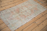 Distressed Oushak runner from a high angle, showing its faded hexagonal medallion.