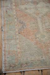 Intact side cord selvage and time-softened low pile of a vintage Oushak rug.