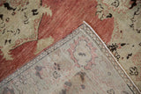 The hand-knotted reverse and restored side cord of a vintage distressed Turkish Oushak rug runner.