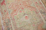 Unique alternating colors and soft, distressed pile of a vintage Turkish Oushak rug's main border.