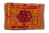 Vintage Oushak rug, red floral medallion, geometric patterns in orange, gold, and grey, 2'5