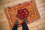 Vintage Oushak rug with black cherry red medallion, finned floral, and geometric motifs.