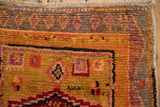 Textured pile vintage Oushak rug, showcasing nuanced geometric floral motifs in tangerine and aubergine.