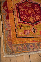 Playful vintage Oushak rug with nuanced geometric floral motifs in tangerine orange, aubergine.
