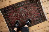 Vintage Persian Dargezine rug with dusty rose, navy, ivory floral, arabesque border.