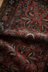 Vintage Dargezine rug mat with soft, varied pile and dusty rose, navy floral vines.