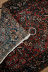 Hand-knotted Persian Dargezine rug pile texture, showing ruby, sapphire floral and vine motifs.