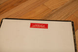 Red S. G. Krebs Co. label on the antique Snellens eye chart with worn edges.