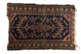 Antique Mehriban rug with dark navy blue field, faded aubergine trefoil medallion, Laleh Abbasi pawn design border.