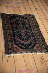 Antique Mehriban rug's tattered Laleh Abbasi border and worn dark navy field.