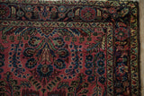 Vintage Lilihan rug corner with meandering vine border and sprawling floral field.