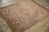 Vintage Anatolian square rug featuring an oversized medallion and time-softened dusty rose colors.