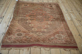 Vintage Anatolian rug corner with geometric T and hook border and secure fringe.