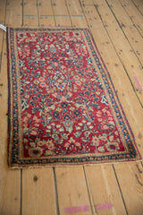 A traditional American Sarouk runner with a cherry red field and dense floral sprays.
