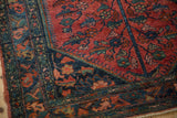 Hand-knotted vintage Lilihan rug corner, with raspberry, navy, teal, and gold floral motifs.