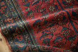 Hand-knotted pile of the vintage Lilihan rug with raspberry red, navy, and gold tree-of-life vines.