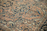 Detailed Heriz pile with abrashed dusty rose, blue, and ivory sprawling floral patterns.