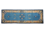 Antique Chinese Peking runner: sky blue field, lotus medallion, butterfly motifs, pale saffron border.