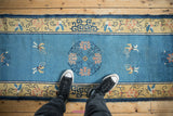 Antique Chinese Peking rug runner, sky blue field, dusty rose lotus roundel, saffron butterflies.