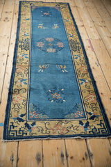 Antique Chinese Peking runner: Sky blue field, delicate rose floral, saffron geometric border with tatter.