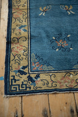 Antique Chinese Peking runner corner, tattered saffron border, navy vines, dusty rose florals.