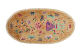 Oval antique Art Deco rug with a floral vase design in violet, jade, and pink on a saffron yellow field.