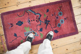 Chinese Art Deco runner's pictorial branch and floral motifs on a cochineal red field.