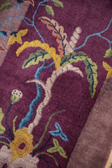 Hand-knotted Chinese Art Deco rug detail: elaborate pictorial plant in aubergine, saffron, celadon.
