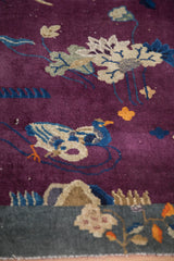 Antique Art Deco rug: sapphire blue bird, antique ivory lotus on deep violet.
