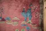 Antique Chinese Art Deco rug detail: blue pagoda, mountain, blossomed tree, dusty blush, tattered edge.
