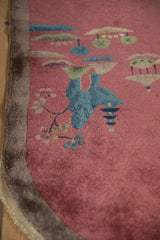 Pictorial Art Deco runner detail: blue bird, blossomed branches on dusty blush field.