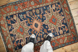 Geometric serrated leaf and roundel blossom patterns on vintage Karaja rug border.