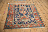Vintage Karaja rug corner, madder red serrated leaf border, cobalt geometric field, fringe.