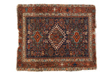 Vintage Karaja square rug with navy field, diamond medallion, pawn design, tattered edges.