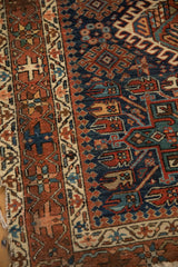 Geometric hook and latch border and pawn design motifs on Vintage Karaja rug.