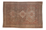 Distressed vintage Shiraz carpet with triple medallion, geometric floral field, chestnut and ivory hues.